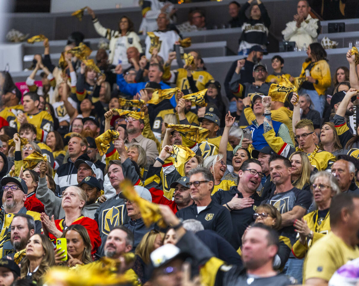 Golden Knights fans celebrate a goal against Minnesota Wild goaltender Filip Gustavsson (32) du ...
