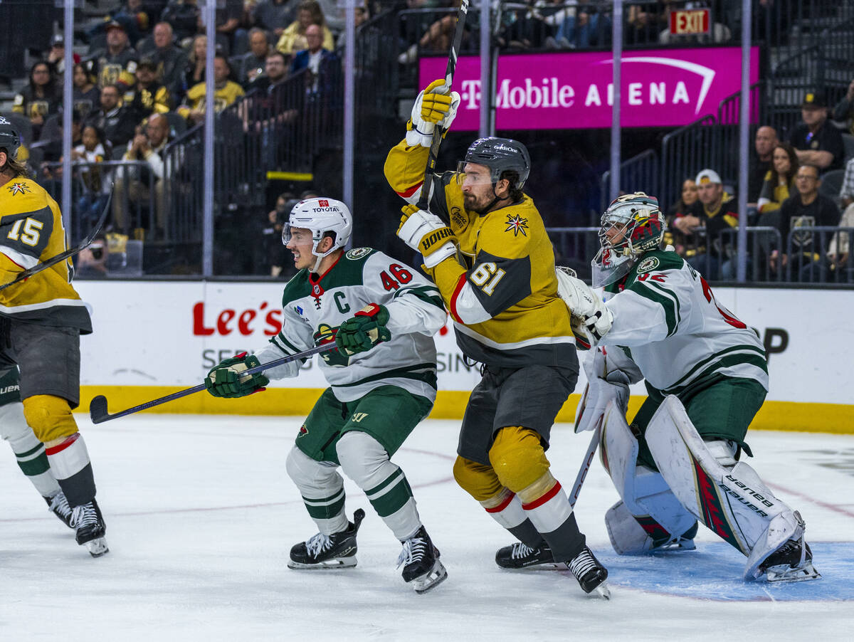 Golden Knights right wing Mark Stone (61) looks for a deflection as he battles close to the net ...
