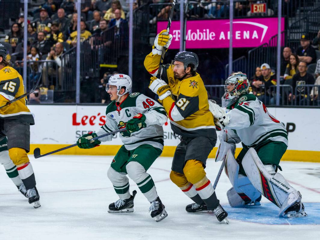 Golden Knights right wing Mark Stone (61) looks for a deflection as he battles close to the net ...