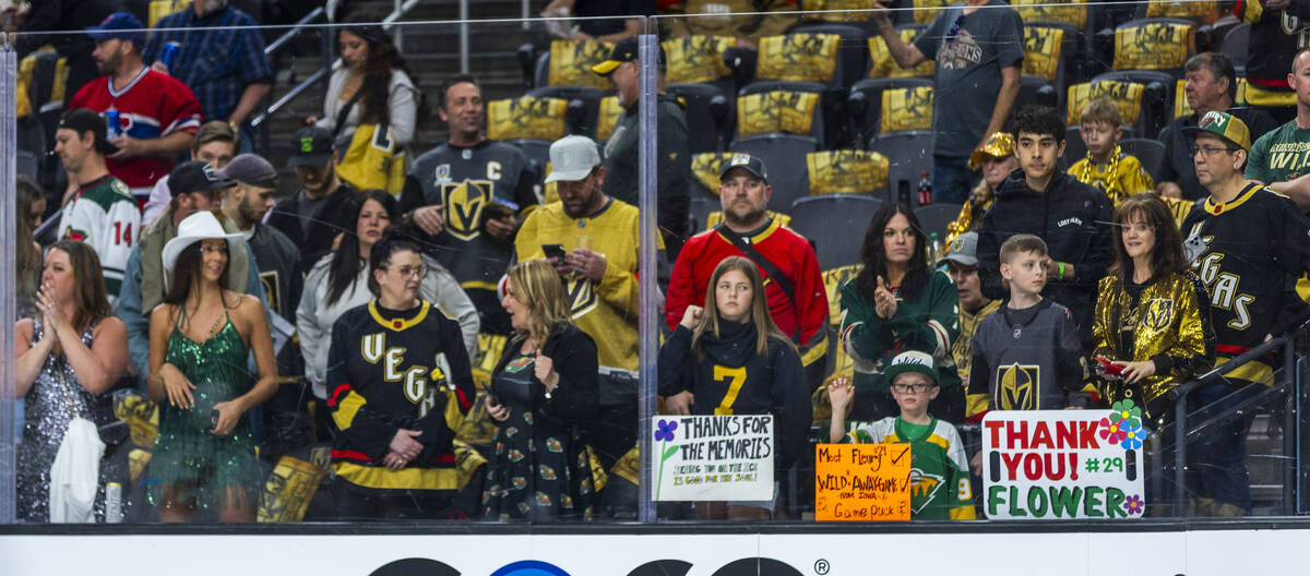 Fans from both teams are along the glass to see Minnesota Wild goaltender Marc-Andre Fleury (29 ...