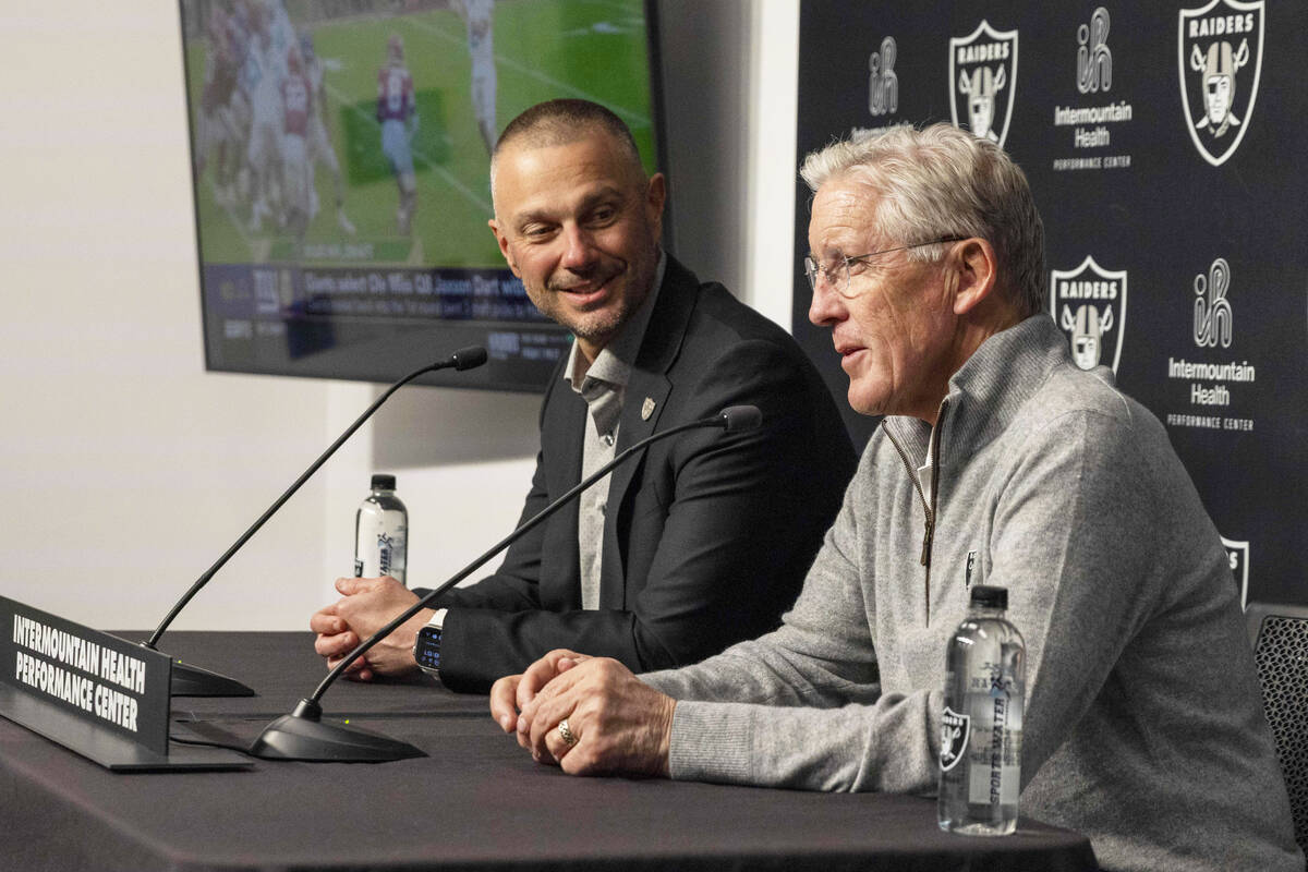 Raiders general manager John Spytek, left, looks to head coach Pete Carroll during a news confe ...