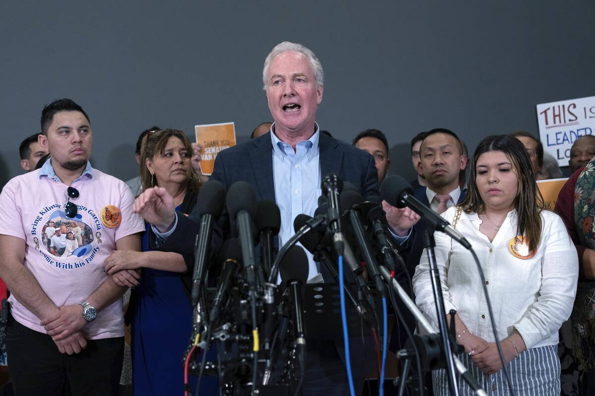 Sen. Chris Van Hollen, D-Md., center, accompanied by Cesar Abrego Garcia, from left, Cecilia Ga ...