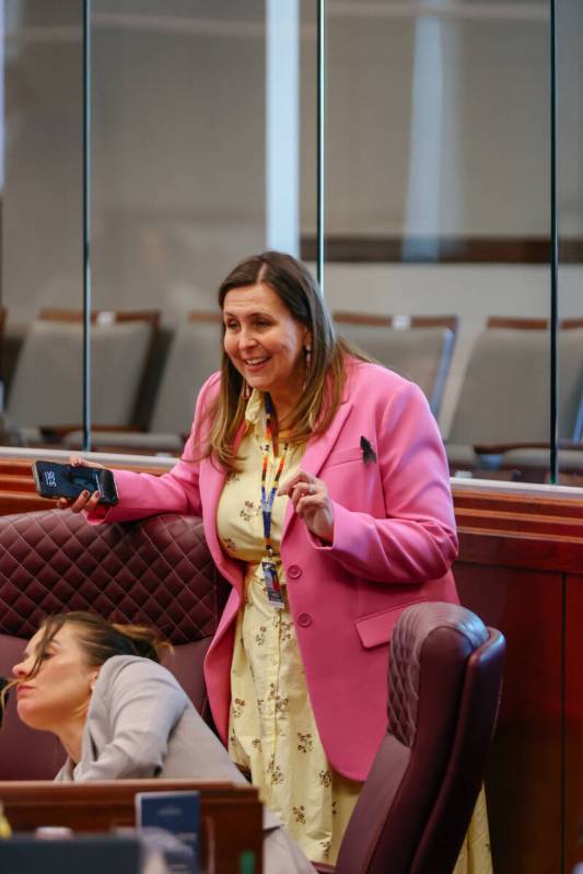 Assemblymember Shea M. Backus, D-Las Vegas, chats with colleagues during a recess as the Nevada ...