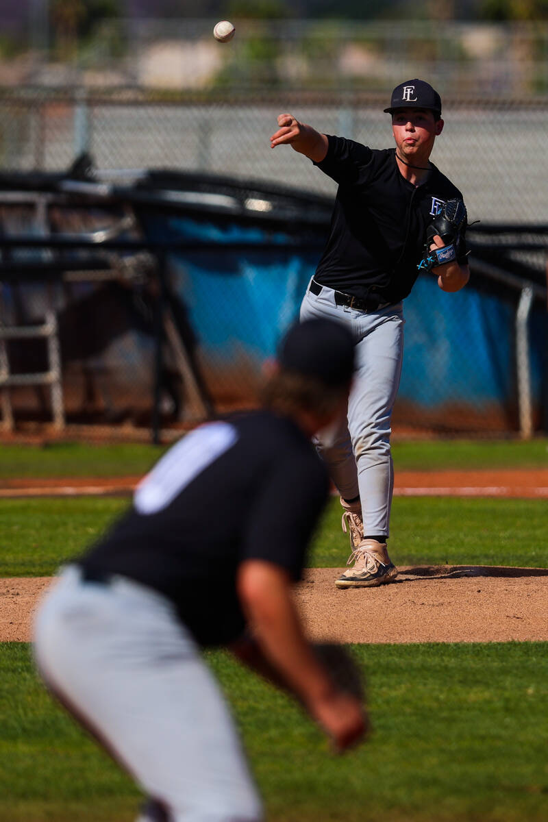 Faith Lutheran pitcher Cash Martin throws the ball to a teammate to hold the runner during a hi ...