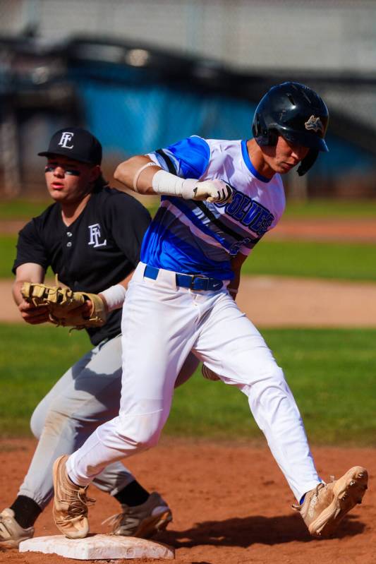 Basic outfielder Troy Southisene (2) runs back to a base during a high school baseball game bet ...