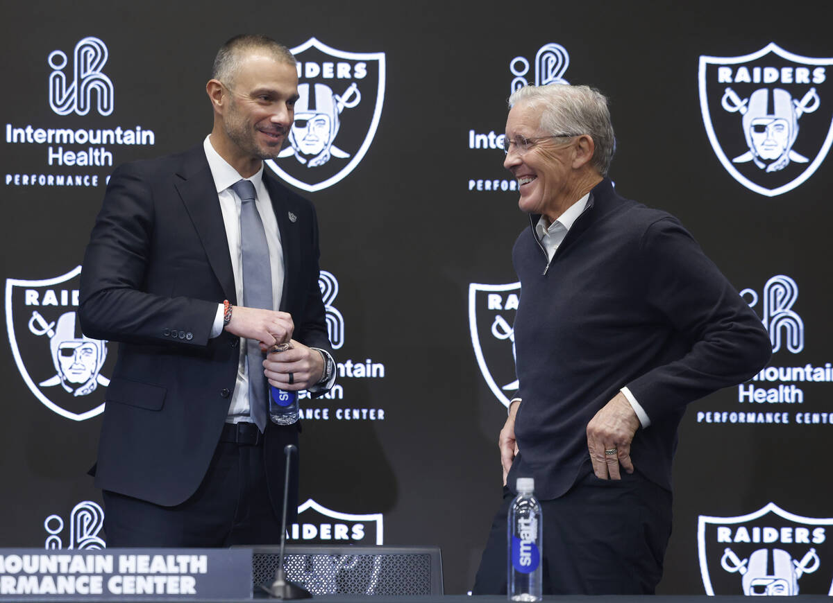 The new Raiders general manager John Spytek, left, and new head coach Pete Carroll share laught ...