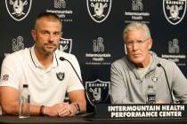 Raiders head coach Pete Carroll and General Manager John Spytek listen to reporters questions d ...