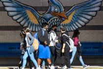 Students at Bailey Middle School walk in the hallway during recess on Friday, Dec. 10, 2021, in ...