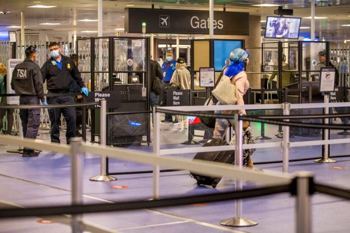 Travelers make their way through the TSA checkpoint at Terminal 1 at Harry Reid International A ...