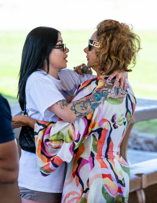 Regina Lacerda, right, receives a hug during a celebration of life for her daughter Tabatha Toz ...
