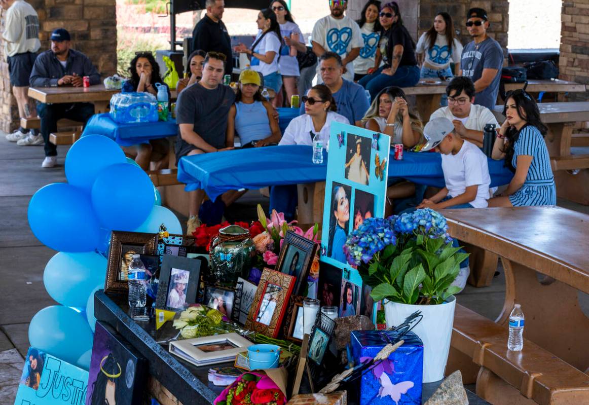 Family and friends listen in as Regina Lacerda talks to the media about her daughter Tabatha To ...