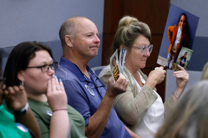 Friends and family members hold photographs of Kamari Jordan Wolfe, a DUI crash victim, during ...