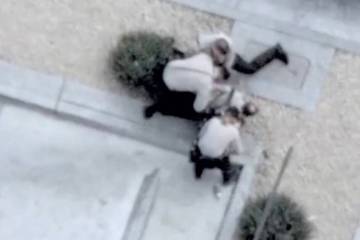 This screen shot from video shows Metropolitan Police Department officers apprehending a man ac ...