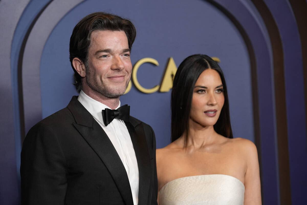 John Mulaney, left, and Olivia Munn arrive at the Governors Awards, Jan. 9, 2024, at the Dolby ...