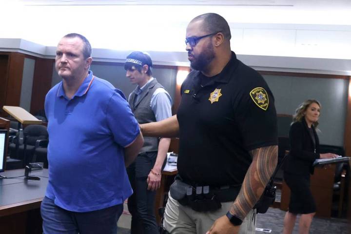 John Jessup is led out of a courtroom after his sentencing while his attorney Ember Grasso, sec ...