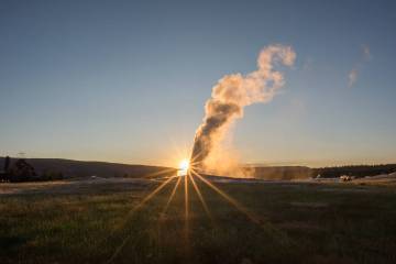 Yellowstone National Park's Old Faithful geyser at sunset. (Dreamstime/TNS)