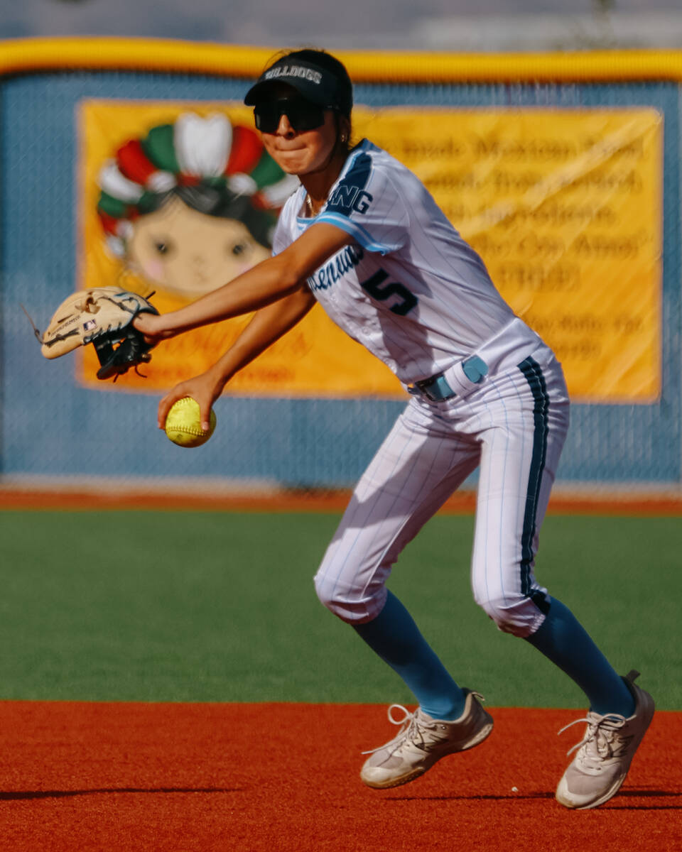 Centennial infielder Valeria Lopez (5) picks up a ground ball during the softball game against ...