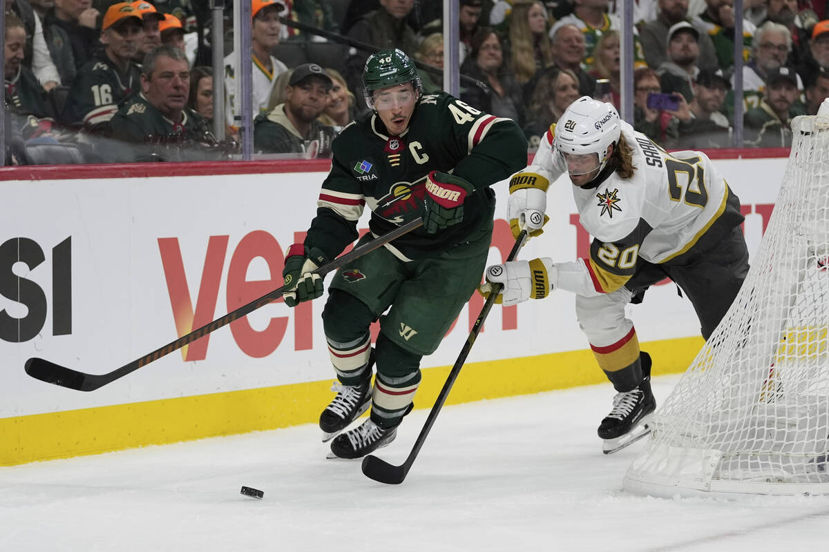 Minnesota Wild defenseman Jared Spurgeon (46) and Vegas Golden Knights left wing Brandon Saad ( ...