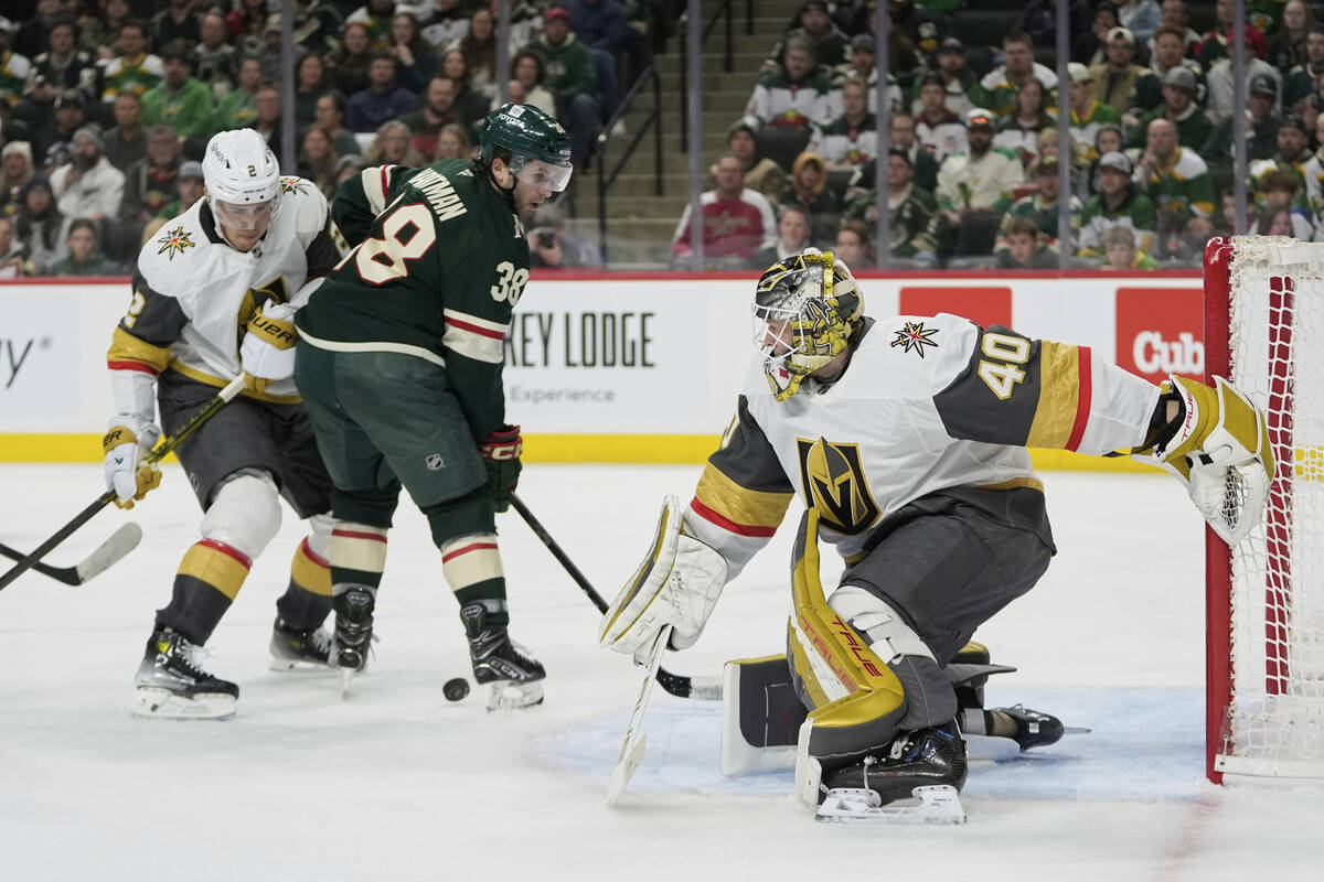 Vegas Golden Knights goaltender Akira Schmid (40) defends against a shot during the third perio ...