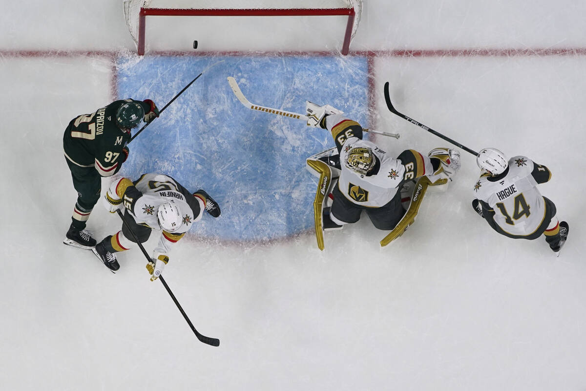 Minnesota Wild left wing Kirill Kaprizov (97) scores a goal past Vegas Golden Knights goaltende ...