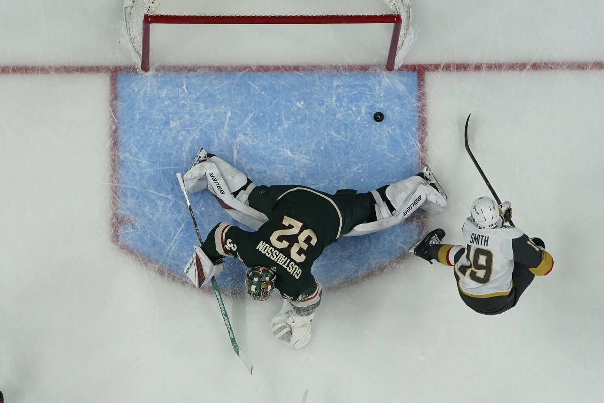 Vegas Golden Knights right wing Reilly Smith (19) scores a goal past Minnesota Wild goaltender ...