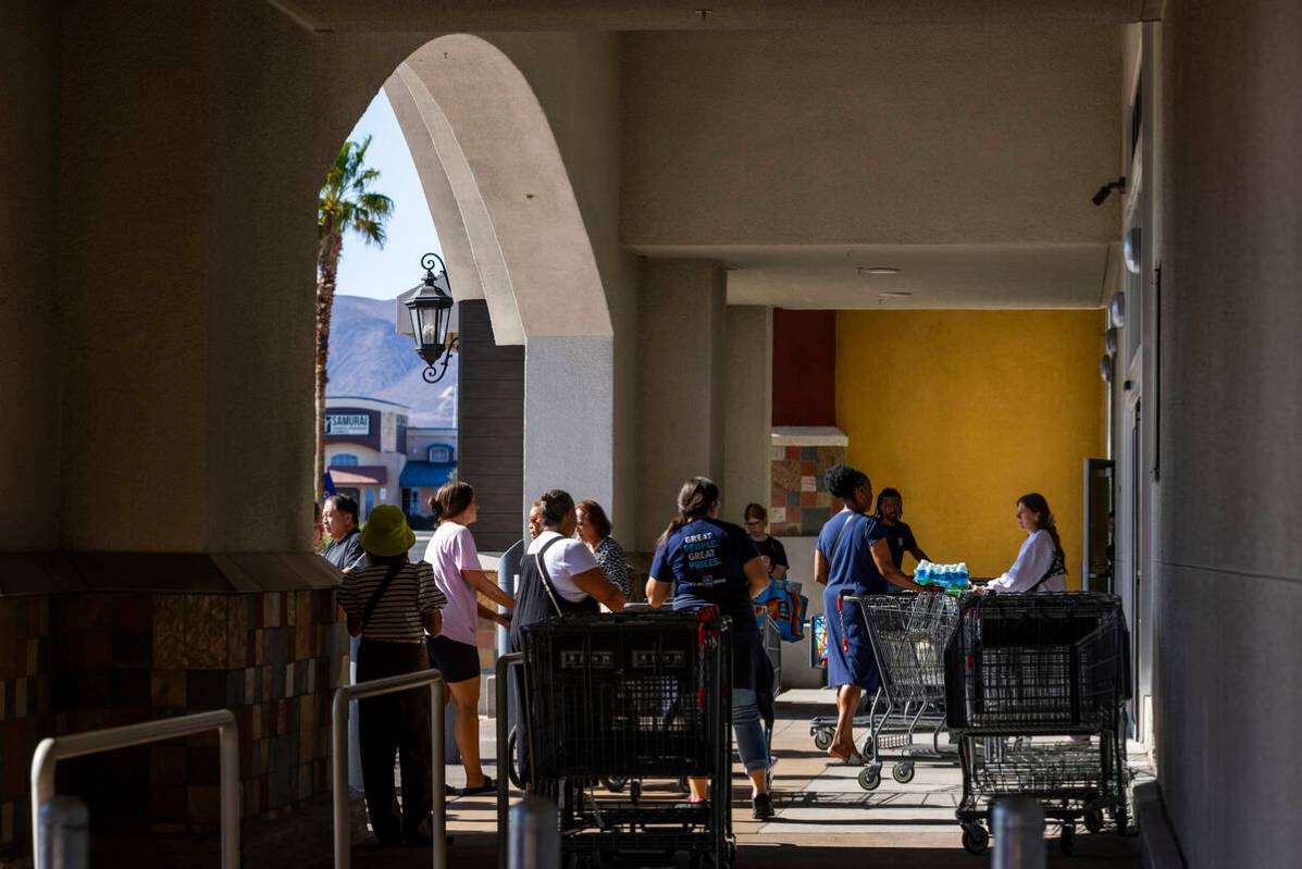 Customers enter and exit the new store as Aldi is officially open on Thursday, April 24, 2025, ...