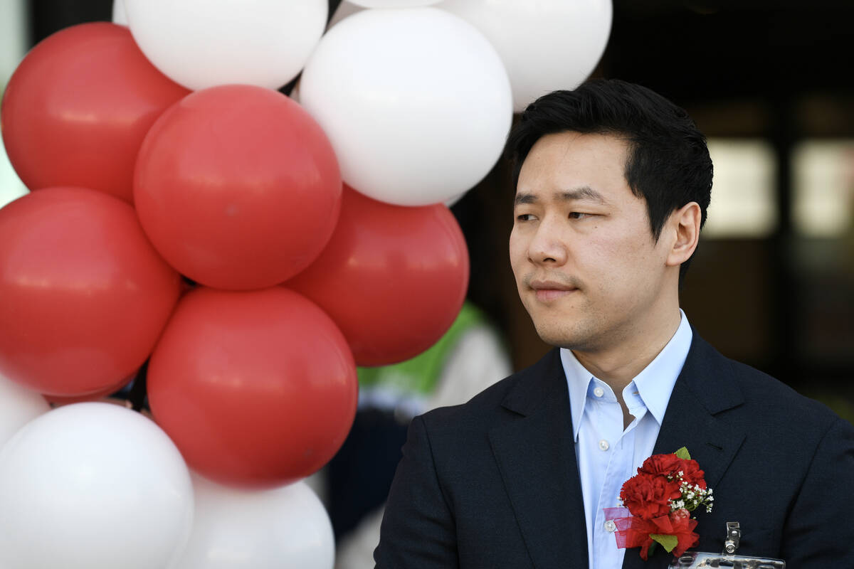 H Mart President Brian Kwon listens to speakers during the grand opening of Las Vegas’ first ...