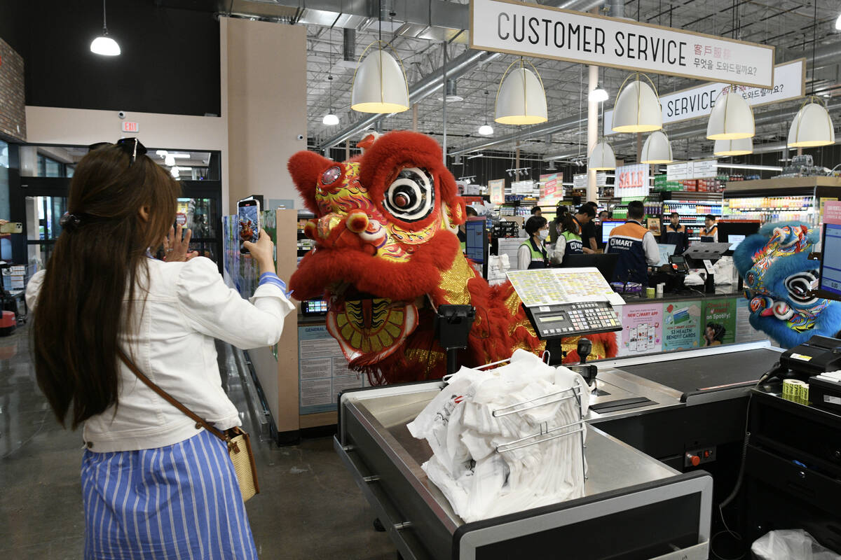 Lion dancers preform during the grand opening of Las Vegas’ first H Mart Thursday, April 24, ...