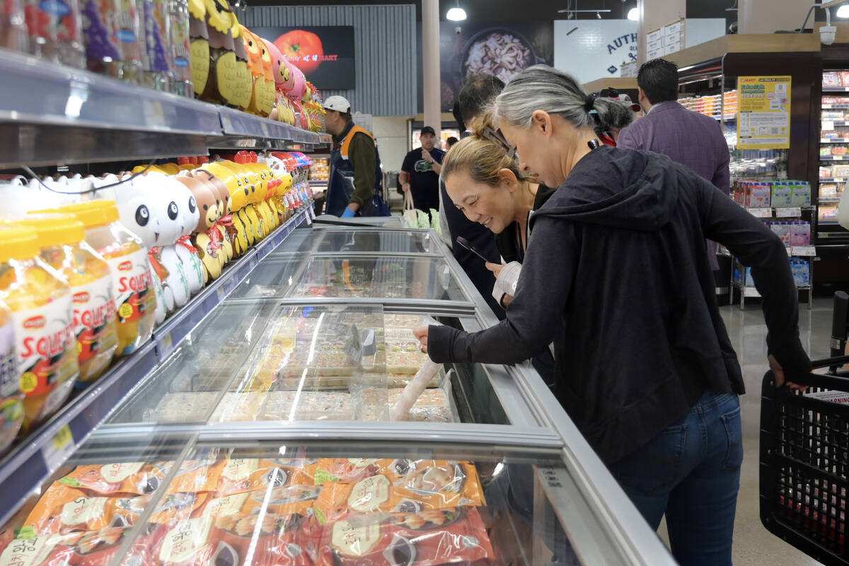 Joice Rhee and Erin Chung shop during the grand opening of Las Vegas’ first H Mart Thursday, ...