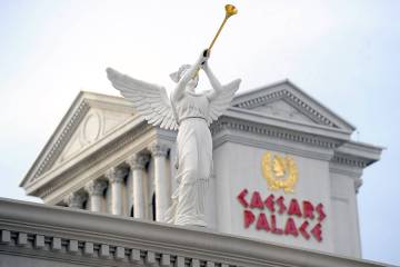 A statue on display is seen in front of Caesars Palace hotel-casino on Thursday, Dec. 11, 2014, ...