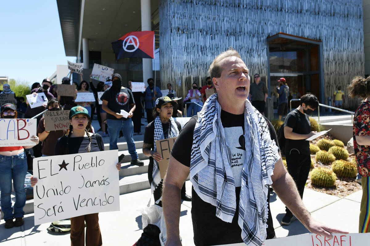 James McCabe joins others during a campus rally to demand UNLV protect students regardless of i ...