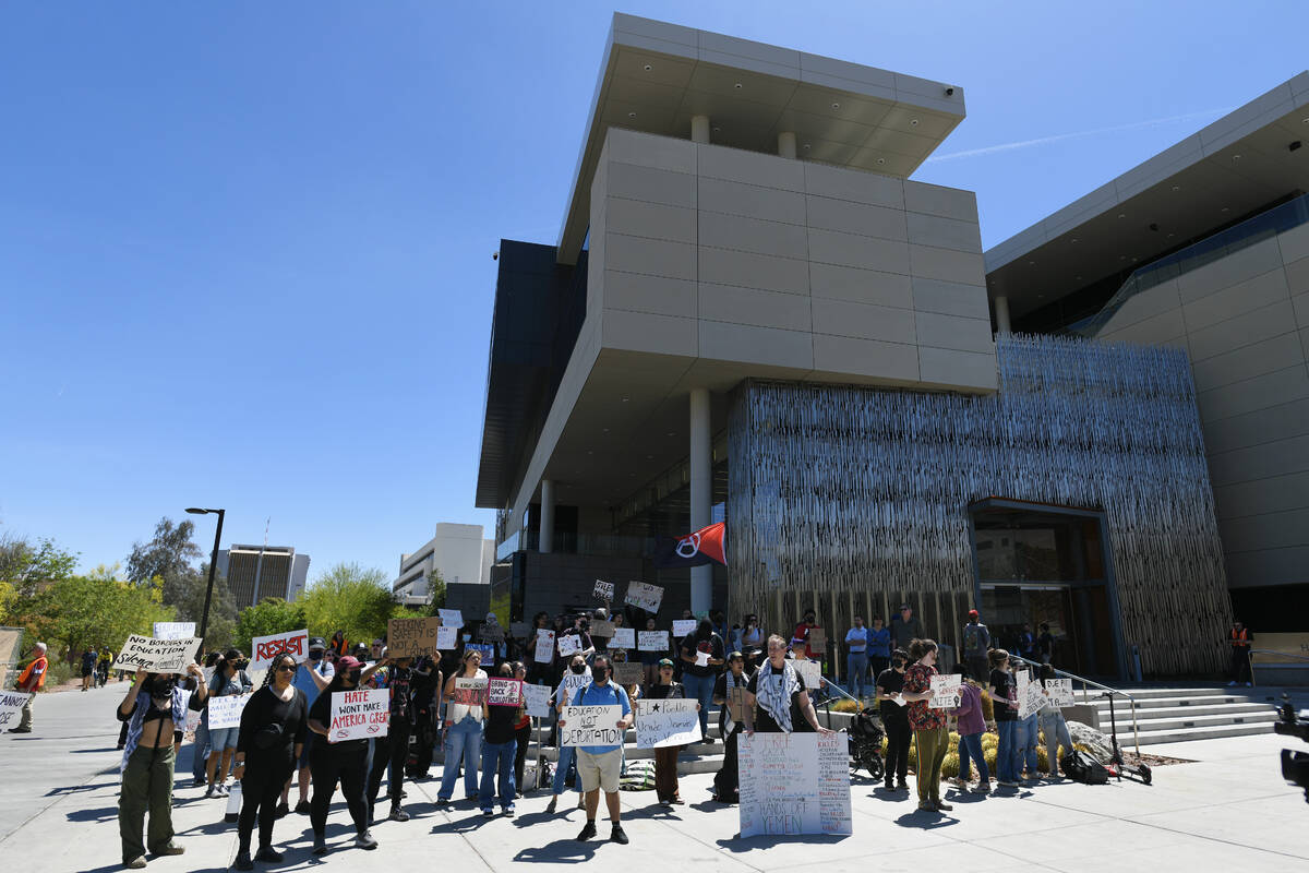 People gather during a campus rally to demand UNLV protect students regardless of immigration s ...