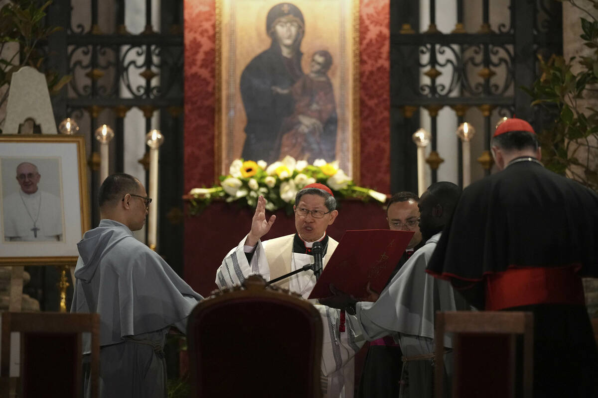 Cardinal Luis Antonio Gokim Tagle leads a rosary prayer outside the Santa Maria Maggiore Basili ...