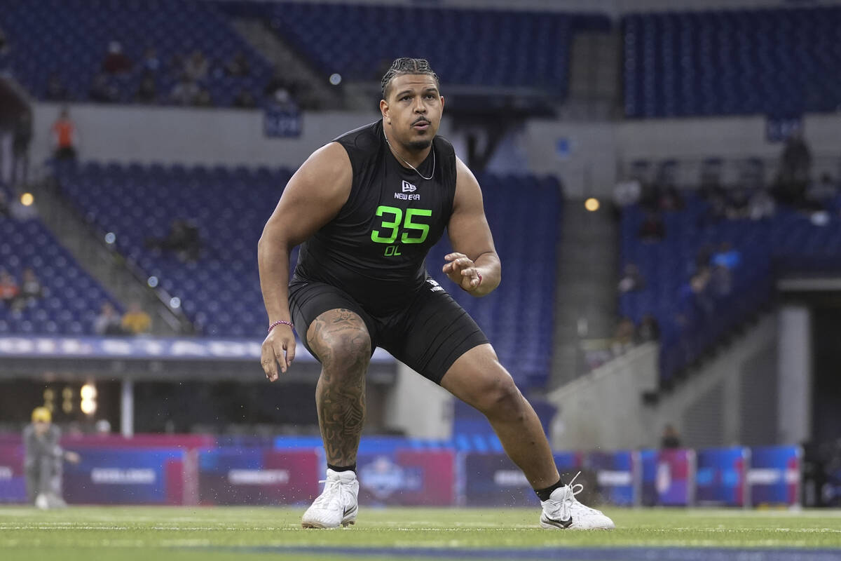 Texas Tech offensive lineman Caleb Rogers runs a drill at the NFL football scouting combine in ...