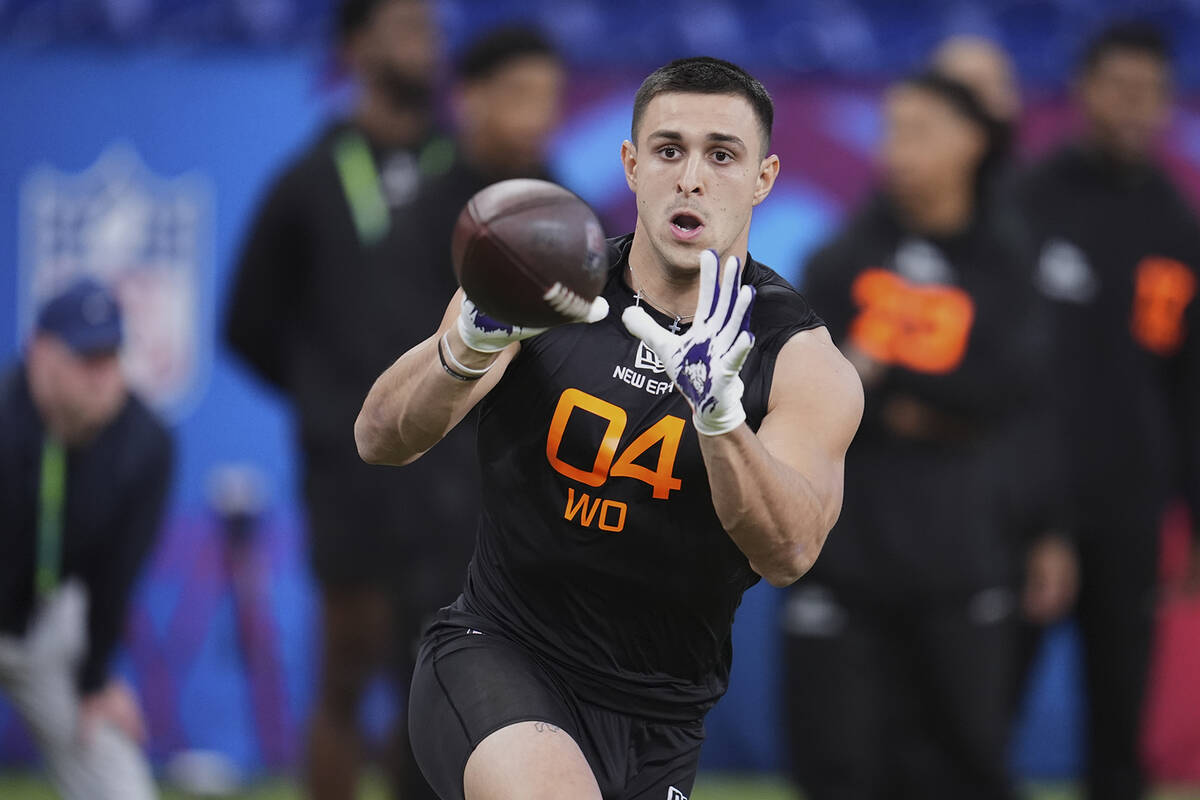 TCU wide receiver Jack Bech runs a drill at the NFL football scouting combine in Indianapolis, ...
