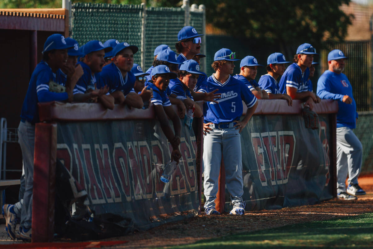 Bishop Gorman players watch game action from the dugout during a baseball game between Desert O ...