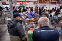 Shoppers line up to check out at a Costco Wholesale in the Van Nuys section of Los Angeles on F ...