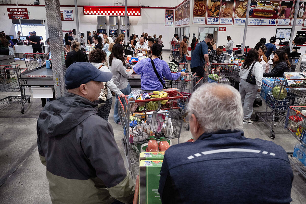 Shoppers line up to check out at a Costco Wholesale in the Van Nuys section of Los Angeles on F ...