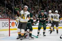 Vegas Golden Knights right wing Mark Stone, left, stands on the ice after a stop by Minnesota W ...