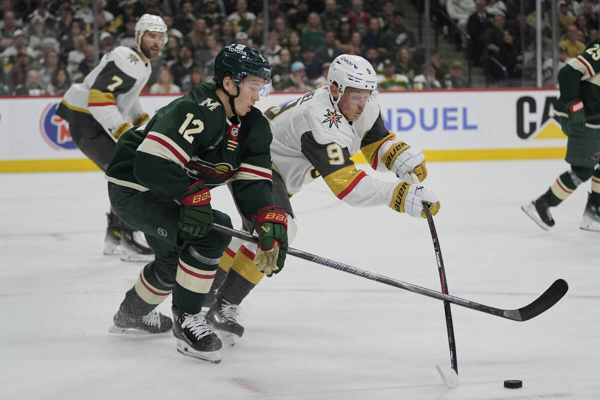 Minnesota Wild left wing Matt Boldy (12) and Vegas Golden Knights center Jack Eichel (9) battle ...
