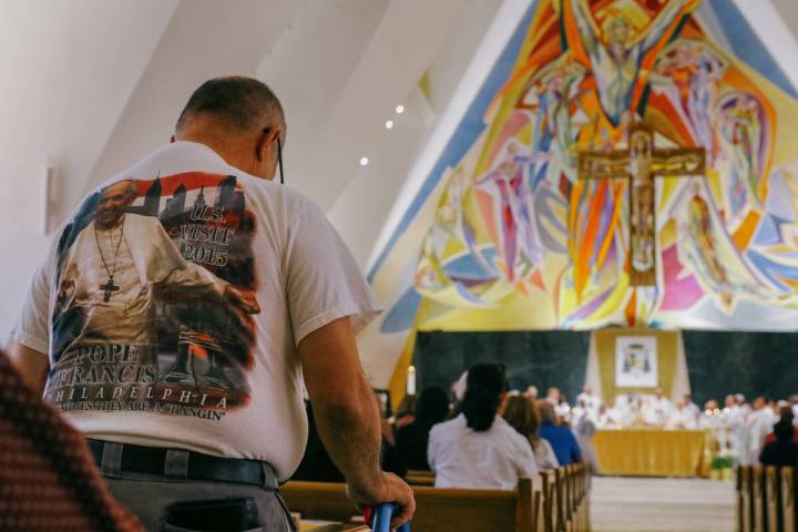 A congregant wears a Pope Francis commemorative shirt from Francis’ 2015 trip to the United S ...