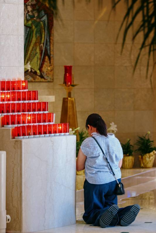 A congregant prays after a memorial Mass in honor of the late Pope Francis on Friday, April 25, ...