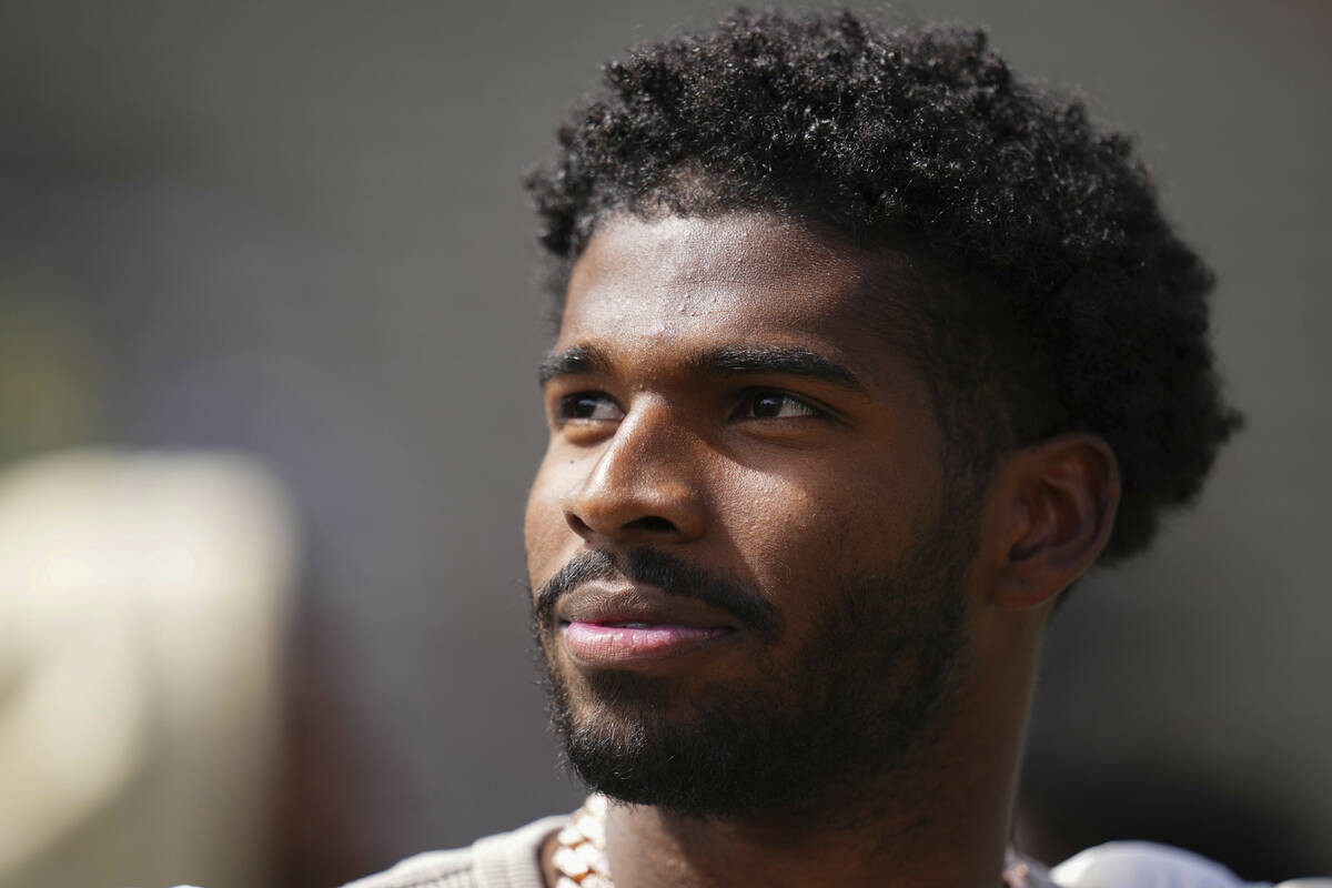 Shedeur Sanders looks on at his jersey retirement ceremony during Colorado's NCAA college footb ...