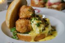 Crab croquette Benedict is being offered for Mother's Day 2025 at Vanderpump à Paris in Pa ...