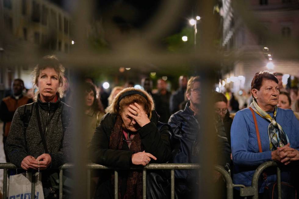 People attend a rosary prayer outside the Santa Maria Maggiore Basilica, where the late Pope Fr ...