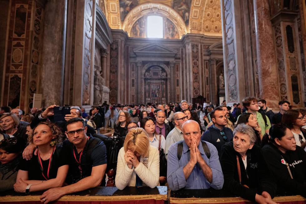 People pay respect to the late Pope Francis, lying in state at St. Peter's Basilica for the fin ...