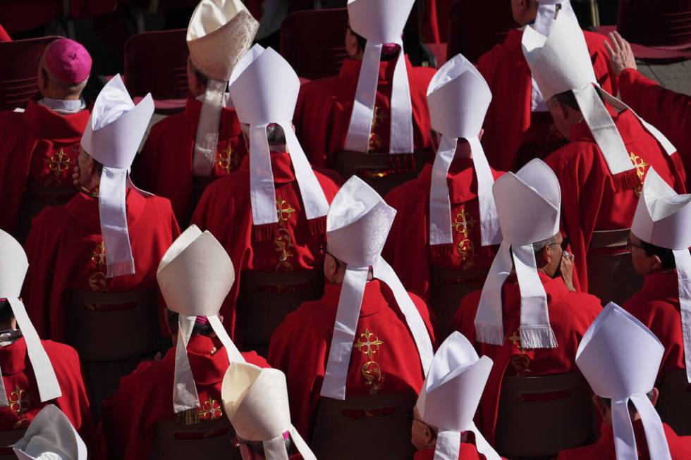 Clergy take their seats ahead of the funeral of Pope Francis in St. Peter's Square at the Vatic ...