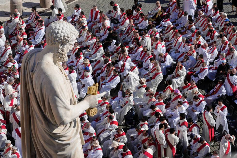 Clergy take their seats for the funeral of Pope Francis in St. Peter's Square at the Vatican, S ...
