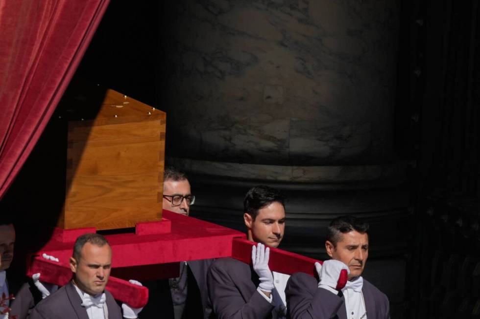 The coffin of Pope Francis is carried out of St Peter's Basilica during his funeral, in St. Pet ...