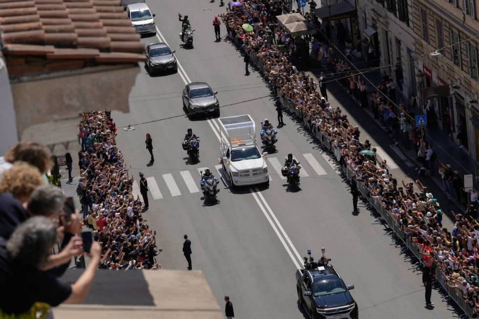 The coffin of Pope Francis makes its way to St. Mary Major Basilica in Rome, Saturday, April 26 ...